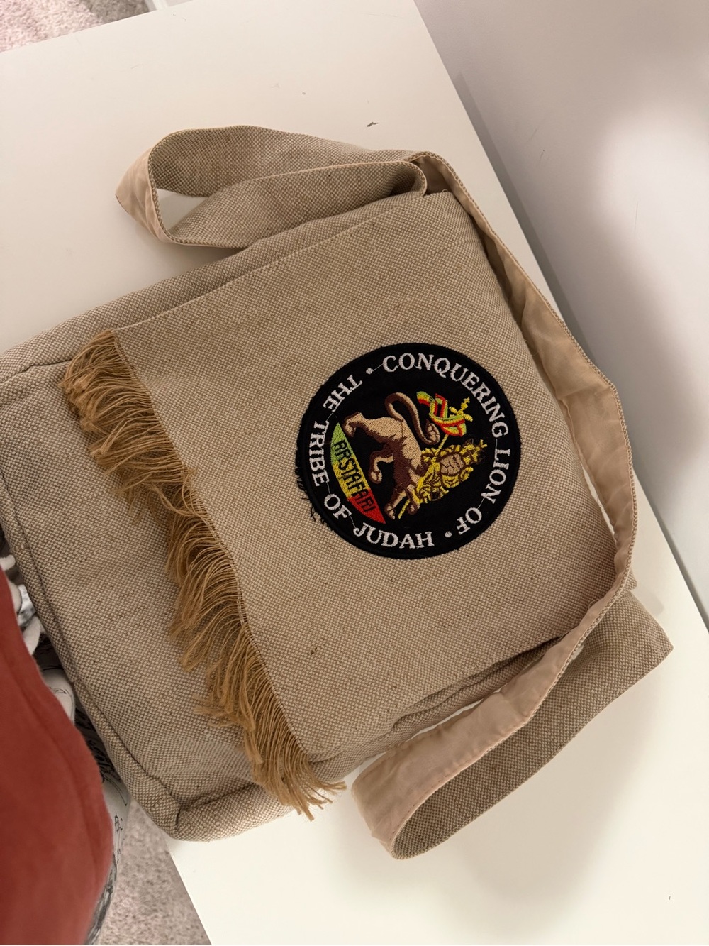 Beige Canvas Crossbody with Lion Patch and Fringe
